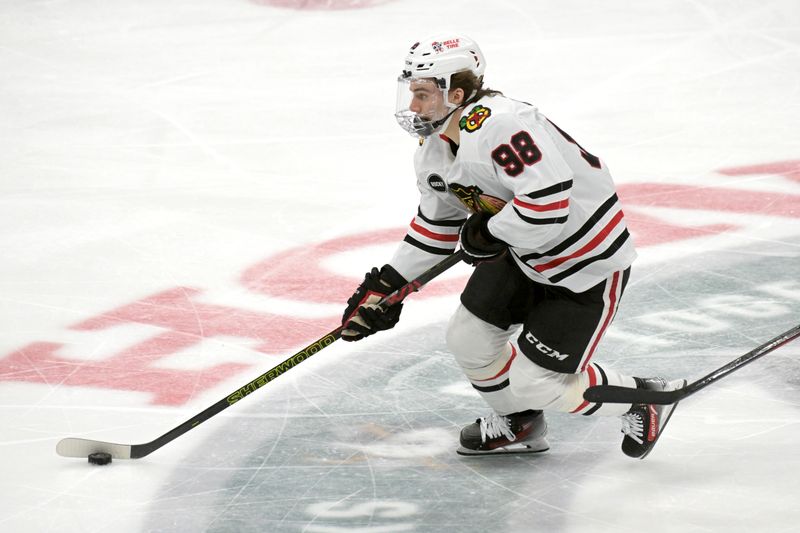 Mar 21, 2024; Anaheim, California, USA; Chicago Blackhawks center Connor Bedard (98) handles the puck in the first period against the Anaheim Ducks at Honda Center. Mandatory Credit: Jayne Kamin-Oncea-USA TODAY Sports