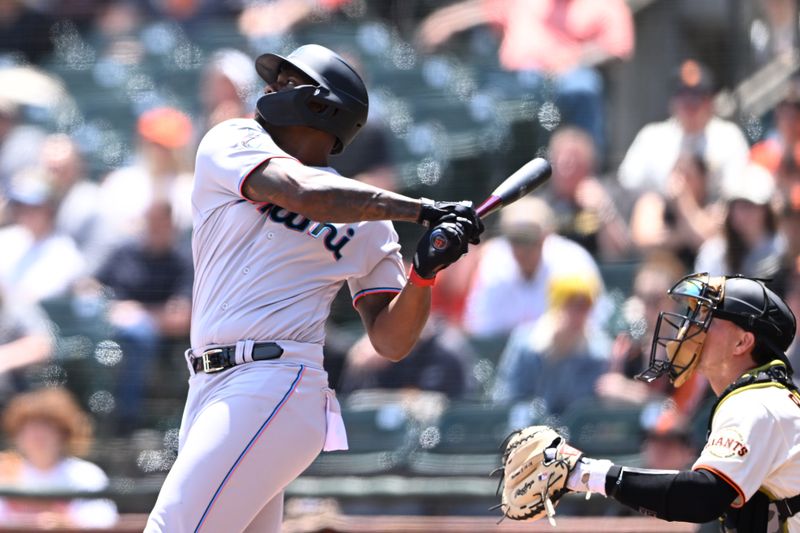 May 21, 2023; San Francisco, California, USA; Miami Marlins designated hitter Jorge Soler (12) hits an RBI single against the San Francisco Giants during the third inning at Oracle Park. Mandatory Credit: Robert Edwards-USA TODAY Sports