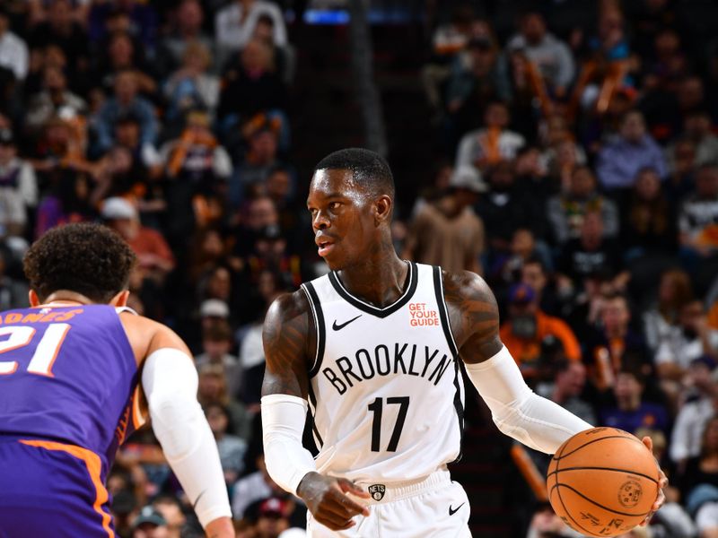 PHOENIX, AZ - NOVEMBER 27: Dennis Schroder #17 of the Brooklyn Nets dribbles the ball during the game against the Phoenix Suns on November 27, 2024 at Footprint Center in Phoenix, Arizona. NOTE TO USER: User expressly acknowledges and agrees that, by downloading and or using this photograph, user is consenting to the terms and conditions of the Getty Images License Agreement. Mandatory Copyright Notice: Copyright 2024 NBAE (Photo by Barry Gossage/NBAE via Getty Images)