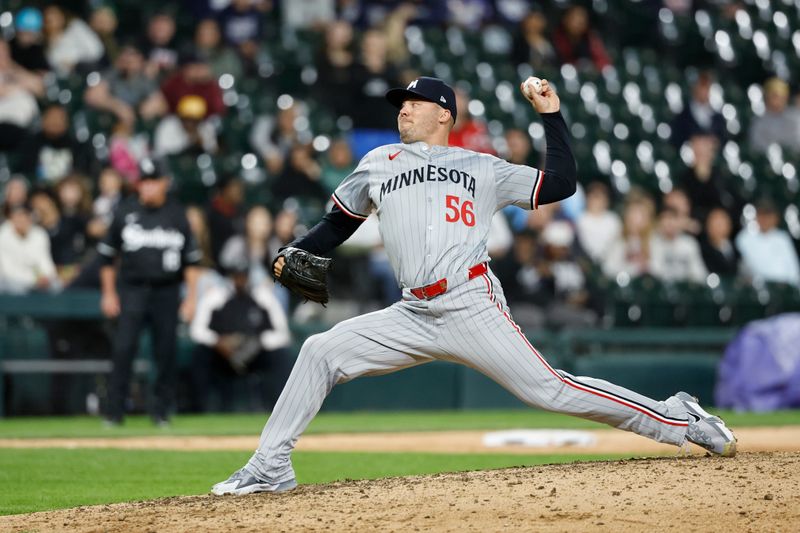 Apr 29, 2024; Chicago, Illinois, USA; Minnesota Twins relief pitcher Caleb Thielbar (56) delivers a pitch against the Chicago White Sox during the ninth inning at Guaranteed Rate Field. Mandatory Credit: Kamil Krzaczynski-USA TODAY Sports