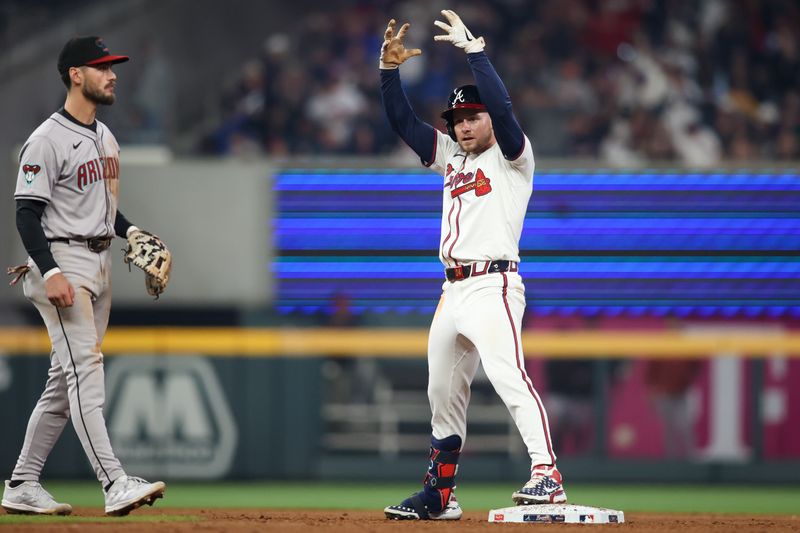 Apr 6, 2024; Atlanta, Georgia, USA; Atlanta Braves left fielder Jarred Kelenic (24) celebrates after a double against the Arizona Diamondbacks in the eighth inning at Truist Park. Mandatory Credit: Brett Davis-USA TODAY Sports
