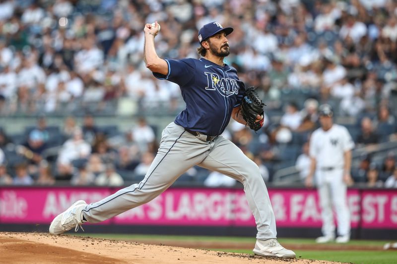 Jul 19, 2024; Bronx, New York, USA;  Tampa Bay Rays starting pitcher Zach Eflin (24) pitches in the first inning against the New York Yankees at Yankee Stadium. Mandatory Credit: Wendell Cruz-USA TODAY Sports