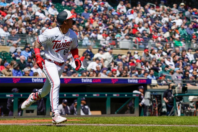 Apr 26, 2023; Minneapolis, Minnesota, USA; Minnesota Twins designated hitter Jose Miranda (64) rounds the bases after a two-run home run against the New York Yankees during the fourth inning at Target Field. Mandatory Credit: Nick Wosika-USA TODAY Sports

