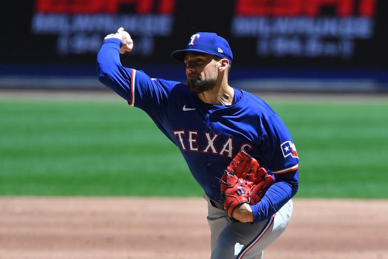 Jun 26, 2024; Milwaukee, Wisconsin, USA; Texas Rangers pitcher Nathan Eovaldi (17) delivers against the Milwaukee Brewers in the first inning at American Family Field. Mandatory Credit: Michael McLoone-USA TODAY Sports