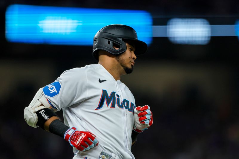 Jun 25, 2023; Miami, Florida, USA; Miami Marlins second baseman Luis Arraez (3) runs toward first base after hitting a single against the Pittsburgh Pirates during the fifth inning at loanDepot Park. Mandatory Credit: Sam Navarro-USA TODAY Sports