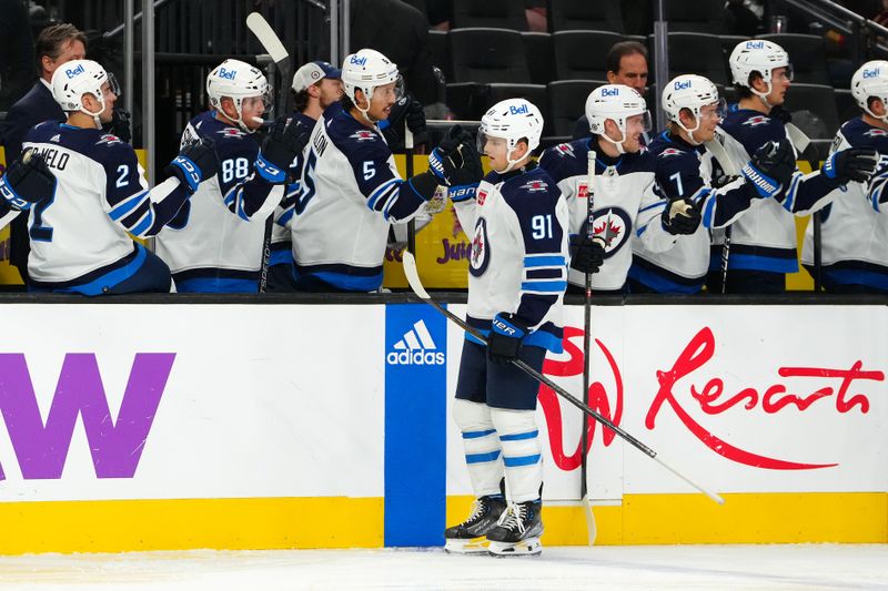 Nov 2, 2023; Las Vegas, Nevada, USA; Winnipeg Jets center Cole Perfetti (91) celebrates after scoring a goal against the Vegas Golden Knights during the third period at T-Mobile Arena. Mandatory Credit: Stephen R. Sylvanie-USA TODAY Sports