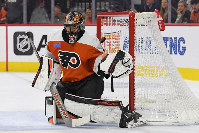 Jan 27, 2025; Philadelphia, Pennsylvania, USA; Philadelphia Flyers goaltender Samuel Ersson (33) can't stop shot by New Jersey Devils defenseman Dougie Hamilton (7) (not pictured) during the second period at Wells Fargo Center. Mandatory Credit: Eric Hartline-Imagn Images