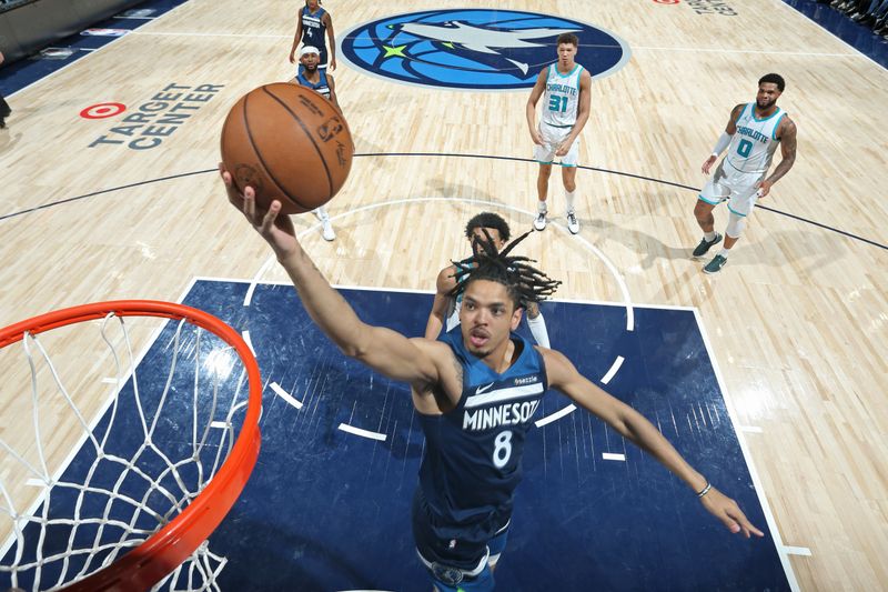 MINNEAPOLIS, MN -  NOVEMBER 4: Josh Minott #8 of the Minnesota Timberwolves drives to the basket during the game against the Charlotte Hornets on November 4, 2024 at Target Center in Minneapolis, Minnesota. NOTE TO USER: User expressly acknowledges and agrees that, by downloading and or using this Photograph, user is consenting to the terms and conditions of the Getty Images License Agreement. Mandatory Copyright Notice: Copyright 2024 NBAE (Photo by David Sherman/NBAE via Getty Images)