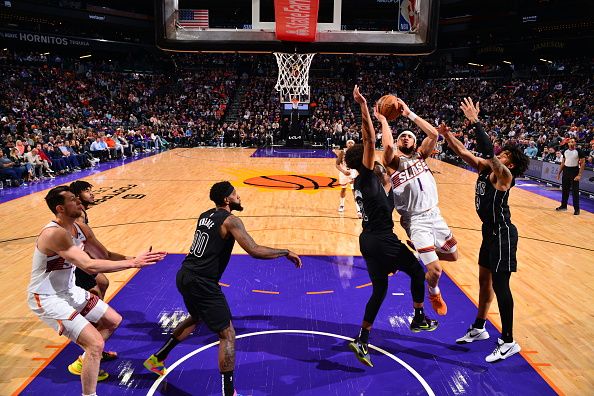 PHOENIX, AZ - DECEMBER 13: Devin Booker #1 of the Phoenix Suns drives to the basket during the game against the Brooklyn Nets on December 13, 2023 at Footprint Center in Phoenix, Arizona. NOTE TO USER: User expressly acknowledges and agrees that, by downloading and or using this photograph, user is consenting to the terms and conditions of the Getty Images License Agreement. Mandatory Copyright Notice: Copyright 2023 NBAE (Photo by Barry Gossage/NBAE via Getty Images)