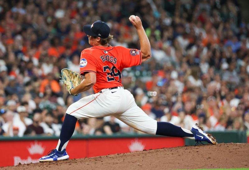 Jun 21, 2024; Houston, Texas, USA; Houston Astros starting pitcher Jake Bloss (39) pitches against the Baltimore Orioles in the third inning at Minute Maid Park. Mandatory Credit: Thomas Shea-USA TODAY Sports