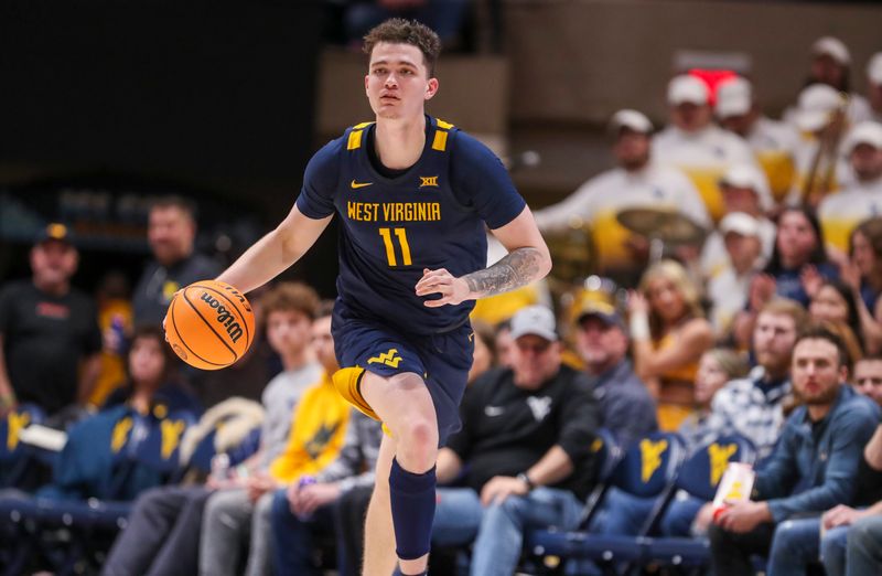 Feb 17, 2024; Morgantown, West Virginia, USA; West Virginia Mountaineers forward Quinn Slazinski (11) dribbles the ball up the floor during the second half against the Baylor Bears  at WVU Coliseum. Mandatory Credit: Ben Queen-USA TODAY Sports