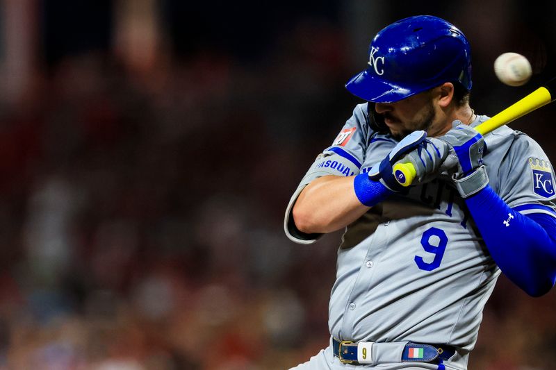 Aug 16, 2024; Cincinnati, Ohio, USA; Kansas City Royals first baseman Vinnie Pasquantino (9) dodges a wild pitch in the seventh inning against the Cincinnati Reds at Great American Ball Park. Mandatory Credit: Katie Stratman-USA TODAY Sports