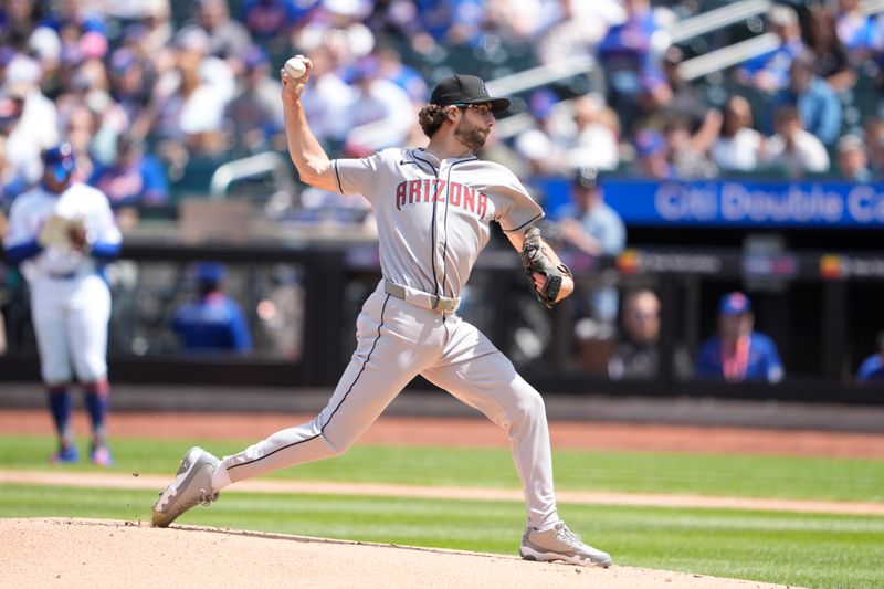May 1, 2025; New York City, New York, USA; Arizona Diamondbacks pitcher Zac Gallen (23) delivers a pitch against the New York Mets during the first inning at Citi Field. Mandatory Credit: Gregory Fisher-Imagn Images