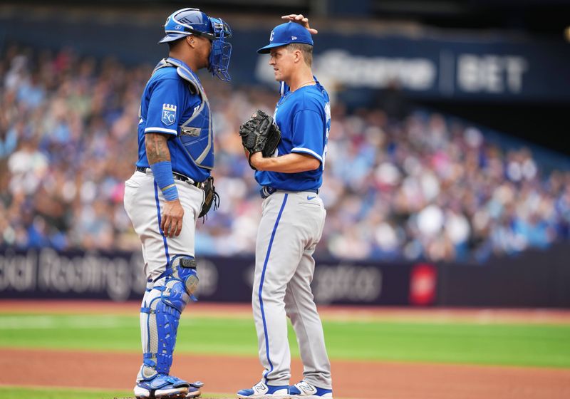 Sep 9, 2023; Toronto, Ontario, CAN; Kansas City Royals catcher Salvador Perez (13) talks with pitcher Zack Greinke (23) against the Toronto Blue Jays during the fourth inning at Rogers Centre. Mandatory Credit: Nick Turchiaro-USA TODAY Sports