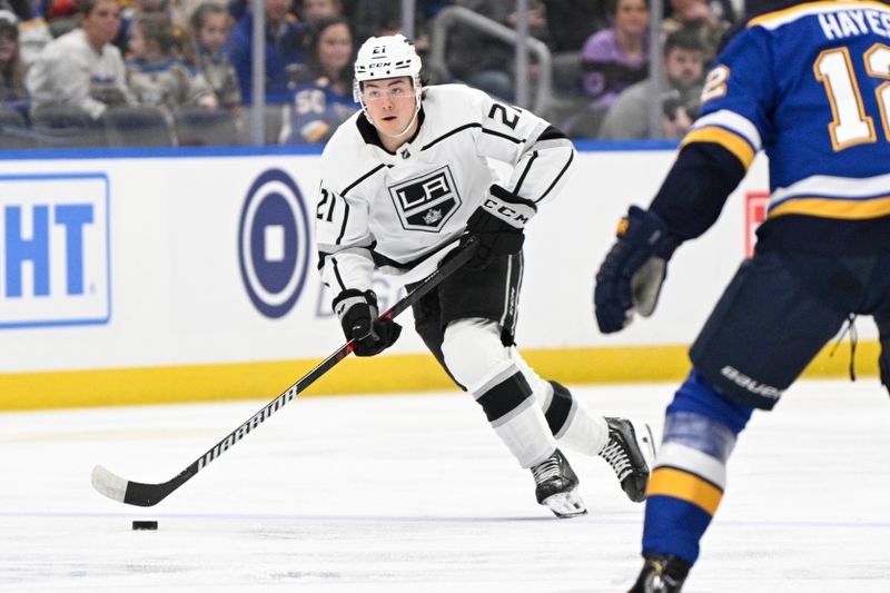 Jan 28, 2024; St. Louis, Missouri, USA; Los Angeles Kings defenseman Jordan Spence (21) skates against the St. Louis Blues during the first period at Enterprise Center. Mandatory Credit: Jeff Le-USA TODAY Sports