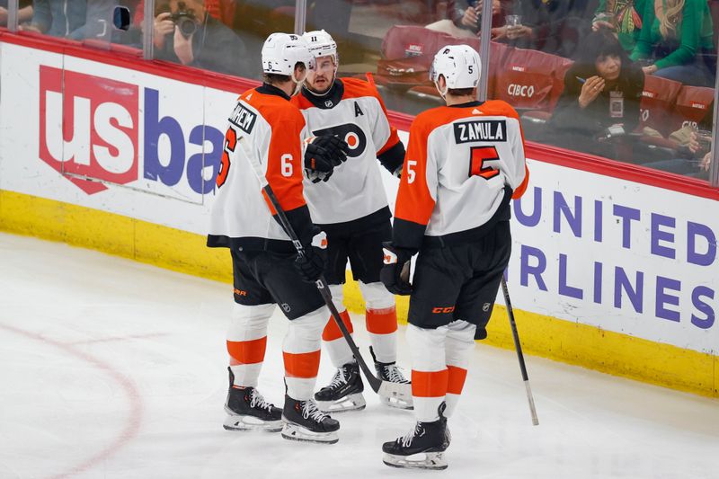 Feb 21, 2024; Chicago, Illinois, USA; Philadelphia Flyers right wing Travis Konecny (11) celebrates with teammates after scoring against the Chicago Blackhawks during the second period at United Center. Mandatory Credit: Kamil Krzaczynski-USA TODAY Sports