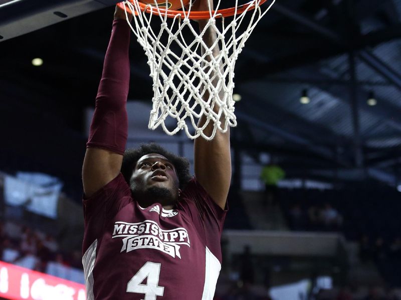 Feb 18, 2023; Oxford, Mississippi, USA; Mississippi State Bulldogs guard/forward Cameron Matthews (4) dunks during the first half against the Mississippi Rebels at The Sandy and John Black Pavilion at Ole Miss. Mandatory Credit: Petre Thomas-USA TODAY Sports