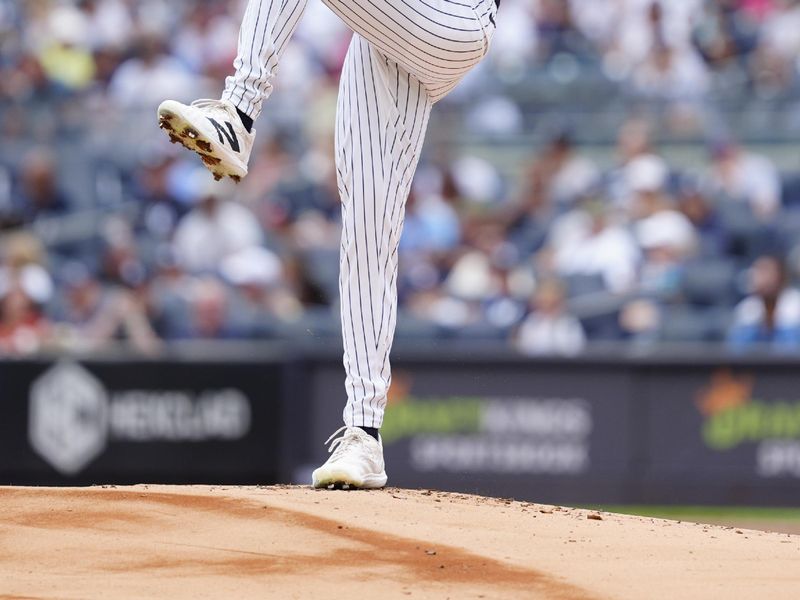 Aug 31, 2024; Bronx, New York, USA; New York Yankees pitcher Will Warren (98) delivers a pitch against the St. Louis Cardinals during the first inning at Yankee Stadium. Mandatory Credit: Gregory Fisher-USA TODAY Sports