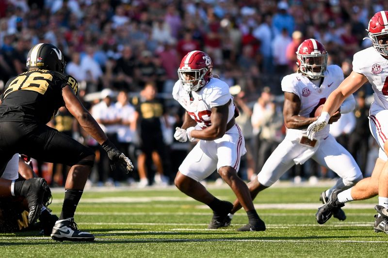 Oct 5, 2024; Nashville, Tennessee, USA;  Alabama Crimson Tide running back Jam Miller (26) runs the ball against the Vanderbilt Commodores during the first half at FirstBank Stadium. Mandatory Credit: Steve Roberts-Imagn Images