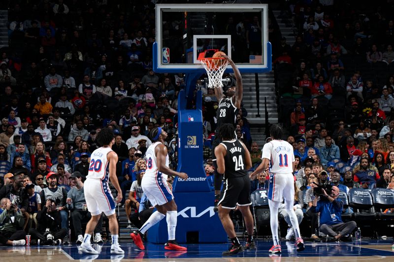 PHILADELPHIA, PA - OCTOBER 16: Dorian Finney-Smith #28 of the Brooklyn Nets dunks the ball during the game against the Philadelphia 76ers on October 16, 2024 at the Wells Fargo Center in Philadelphia, Pennsylvania NOTE TO USER: User expressly acknowledges and agrees that, by downloading and/or using this Photograph, user is consenting to the terms and conditions of the Getty Images License Agreement. Mandatory Copyright Notice: Copyright 2024 NBAE (Photo by David Dow/NBAE via Getty Images)