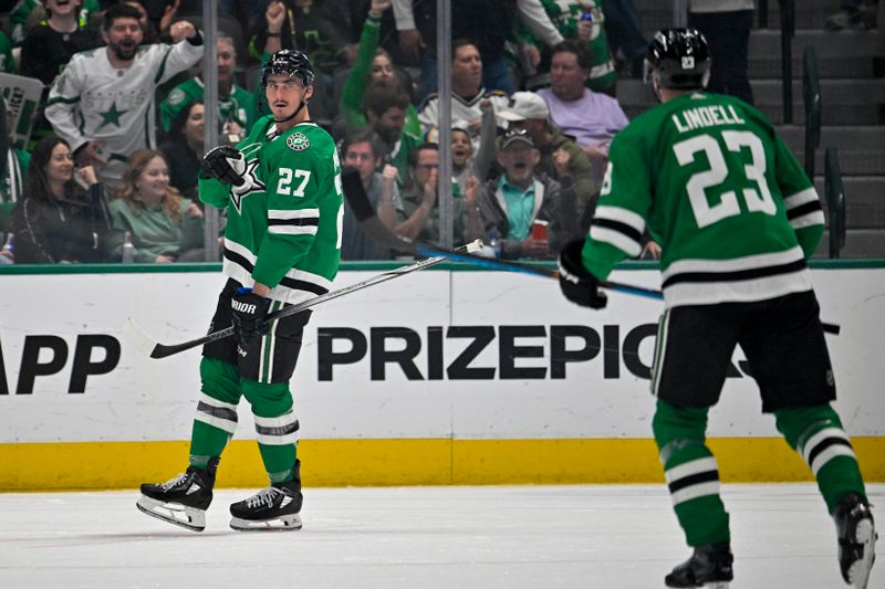 Apr 17, 2024; Dallas, Texas, USA; Dallas Stars left wing Mason Marchment (27) and defenseman Esa Lindell (23) celebrates a goal scored by Marchment against the St. Louis Blues during the third period at the American Airlines Center. Mandatory Credit: Jerome Miron-USA TODAY Sports