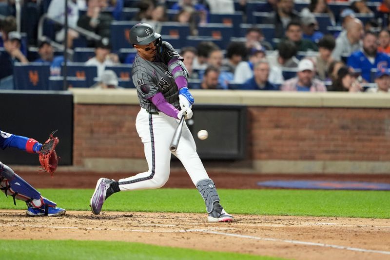 May 10, 2025; New York City, New York, USA;  New York Mets designated hitter Mark Vientos (27) hits a single against the Chicago Cubs during the fourth inning at Citi Field. Mandatory Credit: Gregory Fisher-Imagn Images