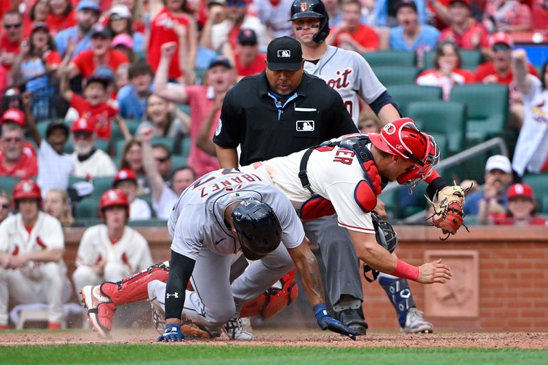 May 6, 2023; St. Louis, Missouri, USA;  St. Louis Cardinals catcher Andrew Knizner (7) tags out Detroit Tigers third baseman Andy Ibanez (77) to end the ninth inning at Busch Stadium. Mandatory Credit: Jeff Curry-USA TODAY Sports