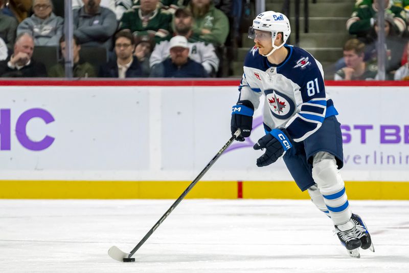 Nov 25, 2024; Saint Paul, Minnesota, USA;  Winnipeg Jets forward Kyle Connor (81) controls the puck against the Minnesota Wild during the third period at Xcel Energy Center. Mandatory Credit: Nick Wosika-Imagn Images