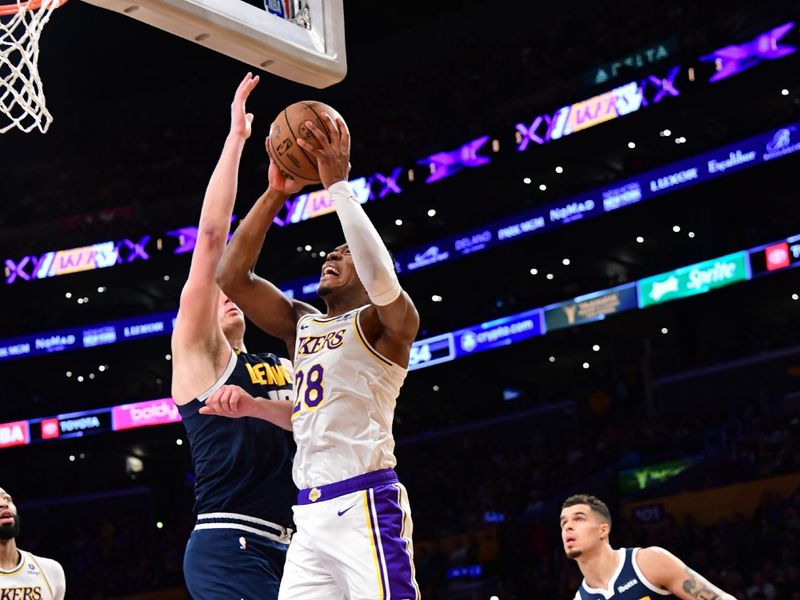 LOS ANGELES, CA - APRIL 27: Rui Hachimura #28 of the Los Angeles Lakers drives to the basket during the game against the Denver Nuggets during Round 1 Game 4 of the 2024 NBA Playoffs on April 27, 2024 at Crypto.Com Arena in Los Angeles, California. NOTE TO USER: User expressly acknowledges and agrees that, by downloading and/or using this Photograph, user is consenting to the terms and conditions of the Getty Images License Agreement. Mandatory Copyright Notice: Copyright 2024 NBAE (Photo by Adam Pantozzi/NBAE via Getty Images)