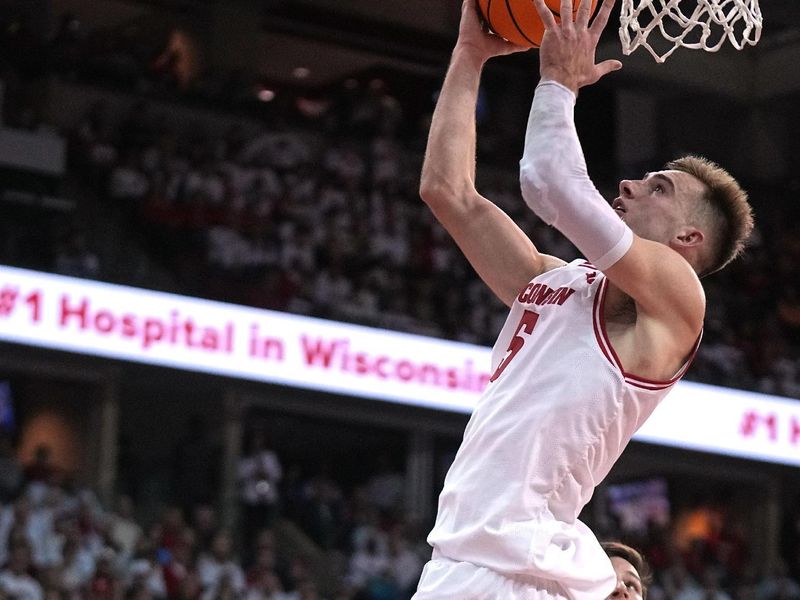 Dec 2, 2023; Madison, Wisconsin, USA; Wisconsin Badgers forward Tyler Wahl (5) scores against the Marquette Golden Eagles during the second half at the Kohl Center. Wisconsin won 75-64. Mandatory Credit: Mark Hoffman/Milwaukee Journal Sentinel via USA TODAY NETWORK