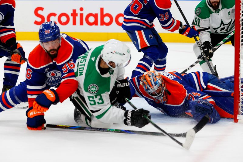 May 25, 2025; Edmonton, Alberta, CAN; Edmonton Oilers goaltender Stuart Skinner (74) stops a shot by Dallas Stars center Wyatt Johnston (53) during the second period in game three of the Western Conference Final of the 2025 Stanley Cup Playoffs at Rogers Place. Mandatory Credit: Perry Nelson-Imagn Images