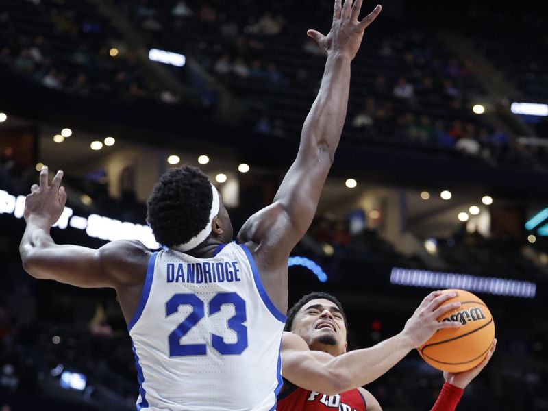 Mar 17, 2023; Columbus, OH, USA; Florida Atlantic Owls guard Bryan Greenlee (4) shoots the ball defended by Memphis Tigers forward Malcolm Dandridge (23) in the second half at Nationwide Arena. Mandatory Credit: Rick Osentoski-USA TODAY Sports