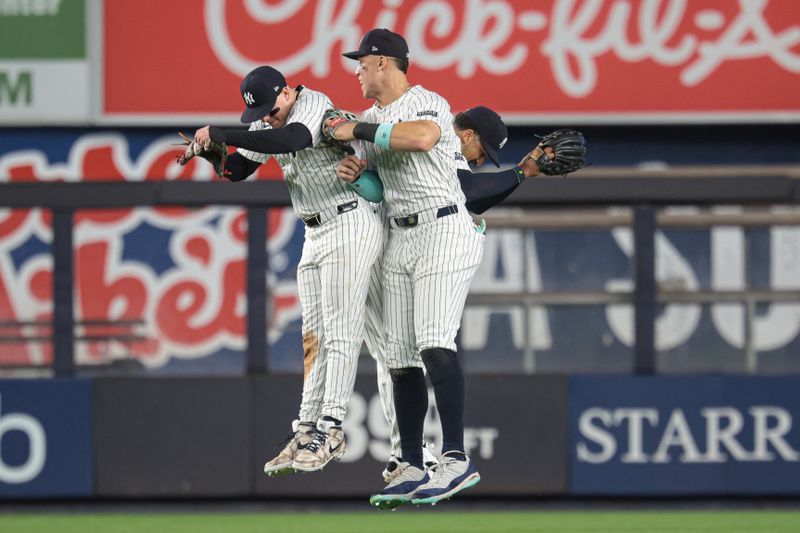 Jun 6, 2024; Bronx, New York, USA;  New York Yankees right fielder Aaron Judge (99) and center fielder Trent Grisham (12) and left fielder Alex Verdugo (24) at Yankee Stadium. Mandatory Credit: Vincent Carchietta-USA TODAY Sports