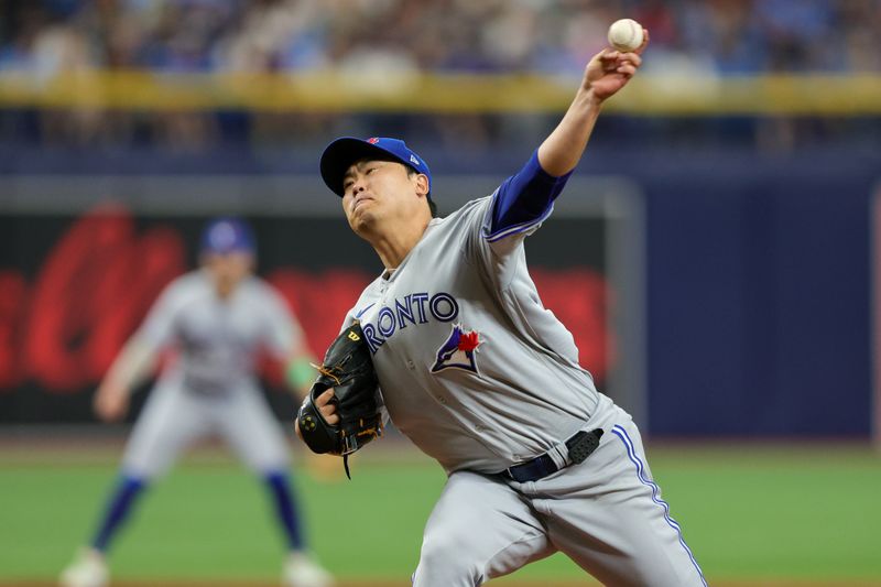 Sep 23, 2023; St. Petersburg, Florida, USA;  Toronto Blue Jays starting pitcher Hyun Jin Ryu (99) throws a pitch against the Tampa Bay Rays in the third inning at Tropicana Field. Mandatory Credit: Nathan Ray Seebeck-USA TODAY Sports