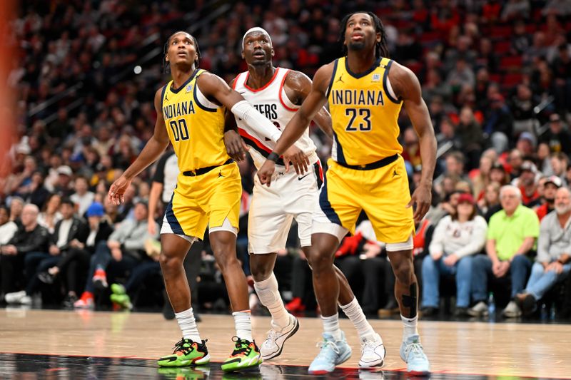 PORTLAND, OREGON - JANUARY 19: Bennedict Mathurin #00 of the Indiana Pacers and Aaron Nesmith #23 box out Duop Reath #26 of the Portland Trail Blazers during the fourth quarter of the game at the Moda Center on January 19, 2024 in Portland, Oregon. The Portland Trail Blazers won 118-115. NOTE TO USER: User expressly acknowledges and agrees that, by downloading and or using this photograph, User is consenting to the terms and conditions of the Getty Images License Agreement. (Photo by Alika Jenner/Getty Images)