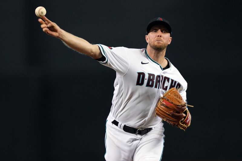 Sep 30, 2023; Phoenix, Arizona, USA; Arizona Diamondbacks starting pitcher Merrill Kelly (29) pitches against the Houston Astros during the third inning at Chase Field. Mandatory Credit: Joe Camporeale-USA TODAY Sports