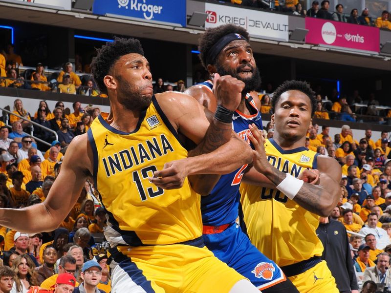 INDIANAPOLIS, IN - MAY 25:  Tony Bradley #13 and Bennedict Mathurin #00 of the Indiana Pacers boxes out during the game against Mitchell Robinson #23 of the New York Knicks during Game Three of the Eastern Conference Finals on May 25, 2025 at Gainbridge Fieldhouse in Indianapolis, Indiana. NOTE TO USER: User expressly acknowledges and agrees that, by downloading and or using this Photograph, user is consenting to the terms and conditions of the Getty Images License Agreement. Mandatory Copyright Notice: Copyright 2025 NBAE (Photo by Ron Hoskins/NBAE via Getty Images)