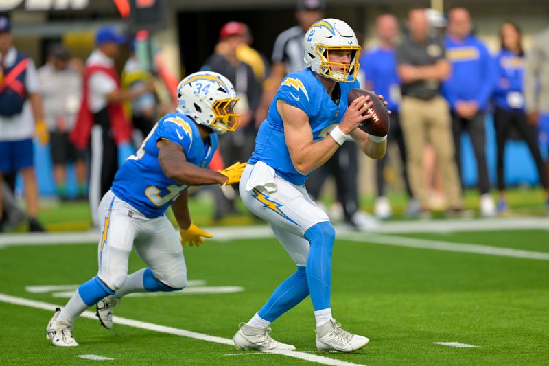 Los Angeles Chargers quarterback Easton Stick (2) takes a snap during the first half of a preseason NFL football game against the Los Angeles Rams, Saturday, Aug. 17, 2024, in Inglewood, Calif. (AP Photo/Jayne Kamin-Oncea)