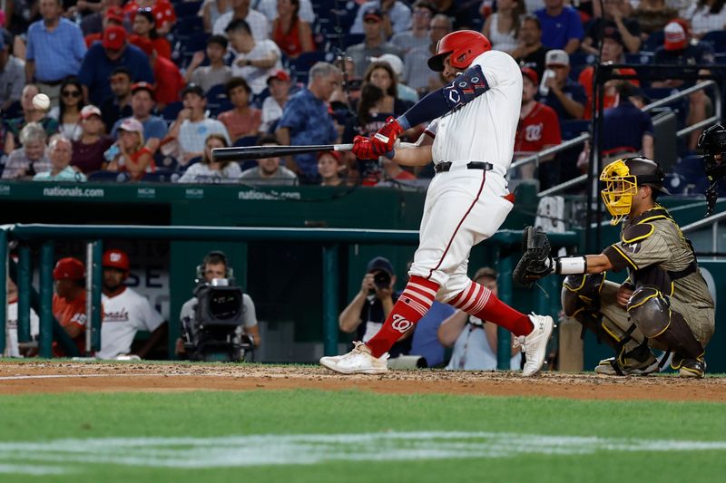 Jul 23, 2024; Washington, District of Columbia, USA; Washington Nationals first baseman Juan Yepez (18) doubles against the San Diego Padres during the eighth inning at Nationals Park. Mandatory Credit: Geoff Burke-USA TODAY Sports