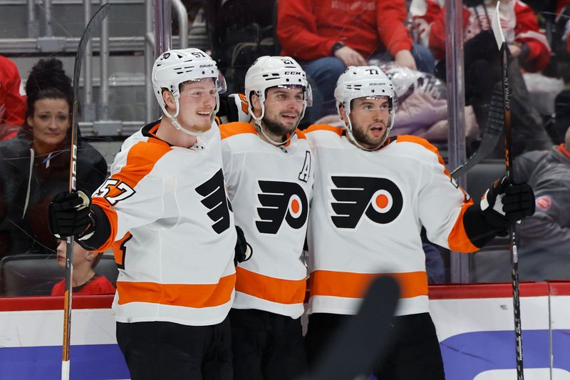 Jan 21, 2023; Detroit, Michigan, USA;  Philadelphia Flyers right wing Wade Allison (57) receives congratulations from teammates after scoring in the third period against the Detroit Red Wings at Little Caesars Arena. Mandatory Credit: Rick Osentoski-USA TODAY Sports