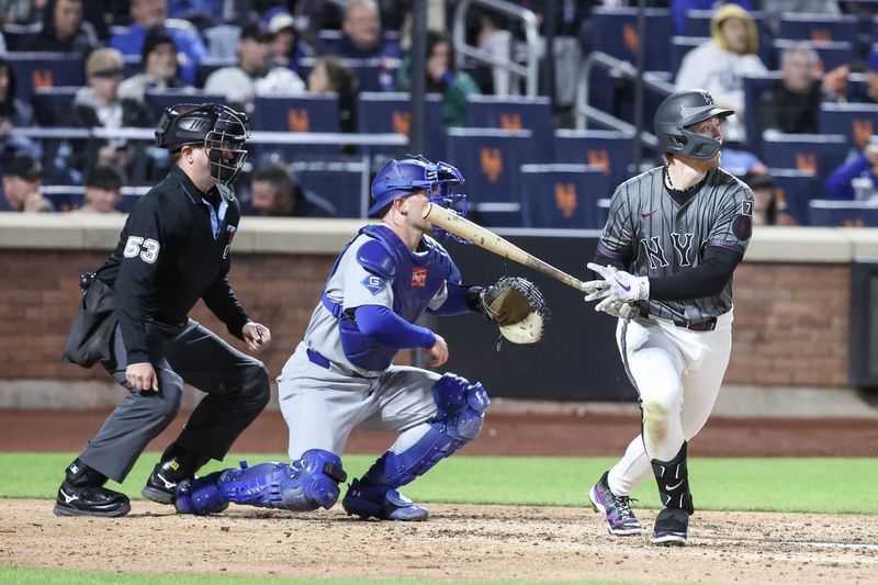 May 24, 2025; New York City, New York, USA;  New York Mets third baseman Brett Baty (7) hits a single in the sixth inning against the Los Angeles Dodgers at Citi Field. Mandatory Credit: Wendell Cruz-Imagn Images
