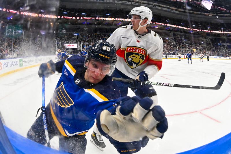 Jan 9, 2024; St. Louis, Missouri, USA;  St. Louis Blues left wing Pavel Buchnevich (89) skates against Florida Panthers defenseman Niko Mikkola (77) during the third period at Enterprise Center. Mandatory Credit: Jeff Curry-USA TODAY Sports