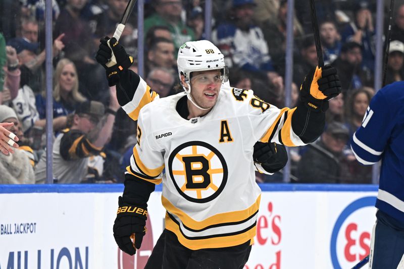 Nov 8, 2025; Toronto, Ontario, CAN;  Boston Bruins forward David Pastrnak (88) celebrates after scoring a goal against the Toronto Maple Leafs in the second period at Scotiabank Arena. Mandatory Credit: Dan Hamilton-Imagn Images