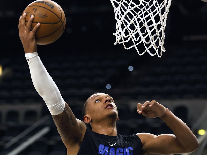 SAN ANTONIO, TX - MARCH 14: Paolo Banchero #5 of the Orlando Magic goes through warm-up drills before the start of their game against the San Antonio Spurs at AT&T Center on March 14, 2023 in San Antonio, Texas. NOTE TO USER: User expressly acknowledges and agrees that, by downloading and or using this photograph, User is consenting to terms and conditions of the Getty Images License Agreement. (Photo by Ronald Cortes/Getty Images)