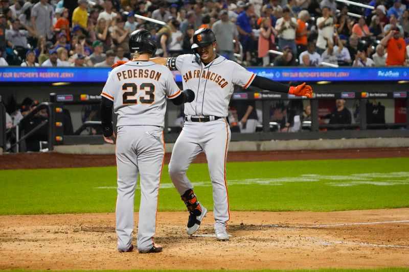 Jul 2, 2023; New York City, New York, USA; San Francisco Giants right fielder Joc Pederson (23) congratulates designated hitter Blake Sabol (2) for hitting a two home run as he crosses home plate against the New York Mets during the seventh inning at Citi Field. Mandatory Credit: Gregory Fisher-USA TODAY Sports