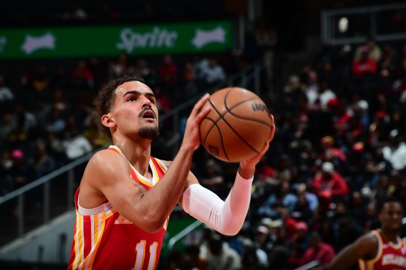 ATLANTA, GA - JANUARY 28: Trae Young #11 of the Atlanta Hawks shoots a free throw during the game against the Toronto Raptors on January 28, 2024 at State Farm Arena in Atlanta, Georgia.  NOTE TO USER: User expressly acknowledges and agrees that, by downloading and/or using this Photograph, user is consenting to the terms and conditions of the Getty Images License Agreement. Mandatory Copyright Notice: Copyright 2024 NBAE (Photo by Scott Cunningham/NBAE via Getty Images)