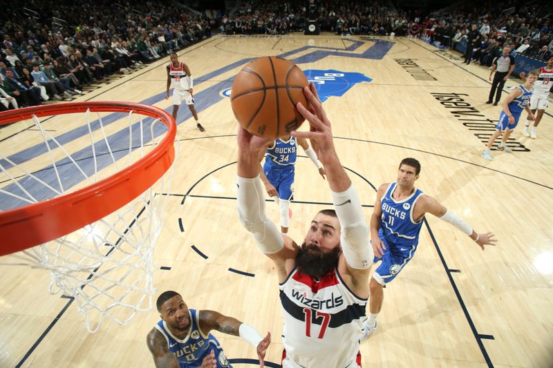 MILWAUKEE, WI - NOVEMBER 30: Jonas Valanciunas #17 of the Washington Wizards dunks the ball during the game against the Milwaukee Bucks on November 30, 2024 at Fiserv Forum Center in Milwaukee, Wisconsin. NOTE TO USER: User expressly acknowledges and agrees that, by downloading and or using this Photograph, user is consenting to the terms and conditions of the Getty Images License Agreement. Mandatory Copyright Notice: Copyright 2024 NBAE (Photo by Gary Dineen/NBAE via Getty Images).