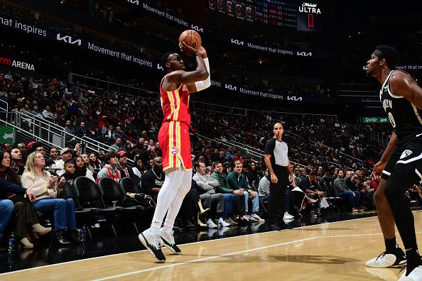 ATLANTA, GA - DECEMBER 6: Onyeka Okongwu #17 of the Atlanta Hawks shoots a three point basket during the game against the Brooklyn Nets on December 6, 2023 at State Farm Arena in Atlanta, Georgia.  NOTE TO USER: User expressly acknowledges and agrees that, by downloading and/or using this Photograph, user is consenting to the terms and conditions of the Getty Images License Agreement. Mandatory Copyright Notice: Copyright 2023 NBAE (Photo by Scott Cunningham/NBAE via Getty Images)