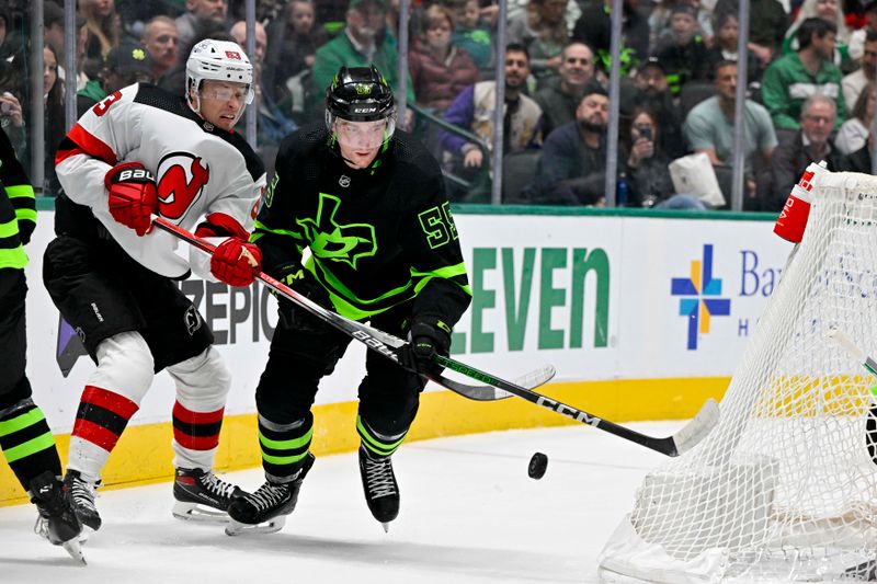 Mar 14, 2024; Dallas, Texas, USA; New Jersey Devils left wing Jesper Bratt (63) and Dallas Stars defenseman Thomas Harley (55) battle for control of the puck during the first period at the American Airlines Center. Mandatory Credit: Jerome Miron-USA TODAY Sports