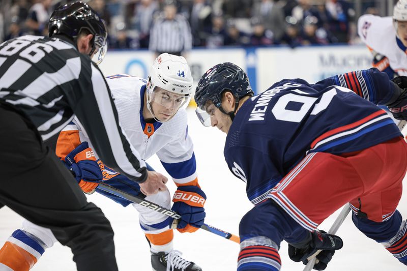 Mar 17, 2024; New York, New York, USA; New York Islanders center Bo Horvat (14) faces off against New York Rangers center Alex Wennberg (91) during the first period at Madison Square Garden. Mandatory Credit: Vincent Carchietta-USA TODAY Sports